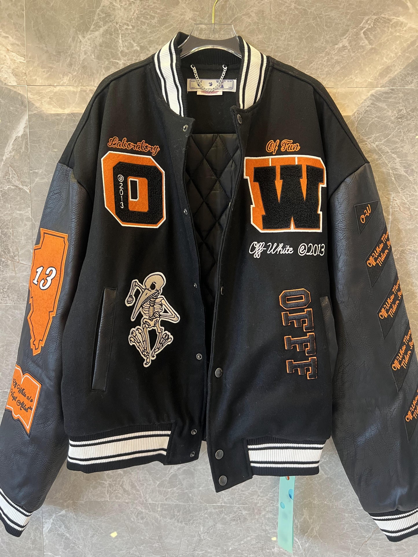 Off-White black varsity jacket with embroidered patches and skeleton design