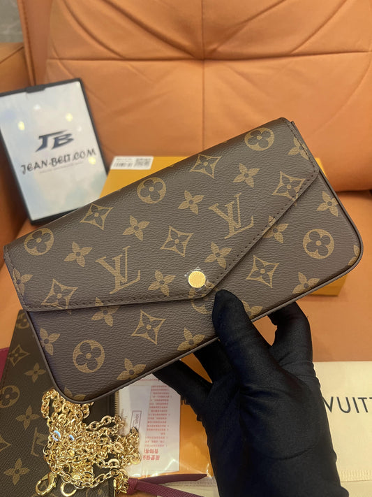 Cartera con cadena Felicie y pochette con monograma de Louis Vuitton fucsia