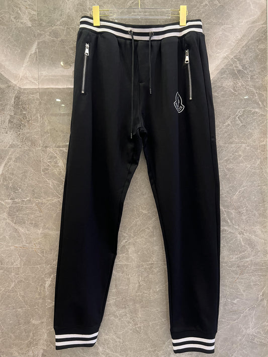Conjunto de chaqueta y pantalón deportivo negro Moncler con ribete blanco