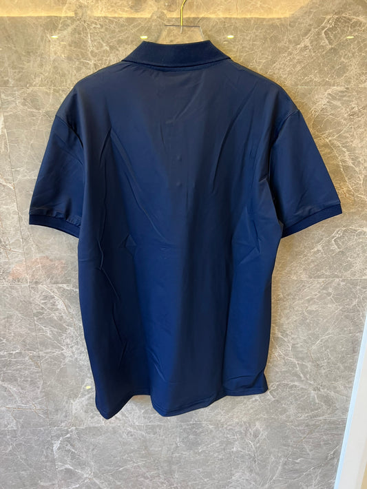 Polo beige y azul marino con monograma de Gucci y estampado GG