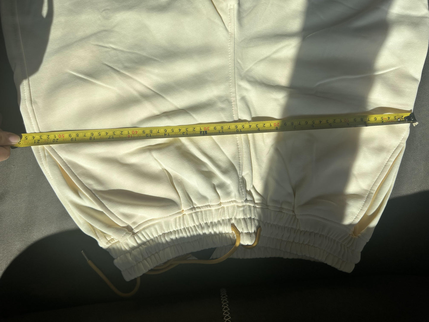 Pantalones cortos blancos con cordón y logotipo de Rhude x McLaren