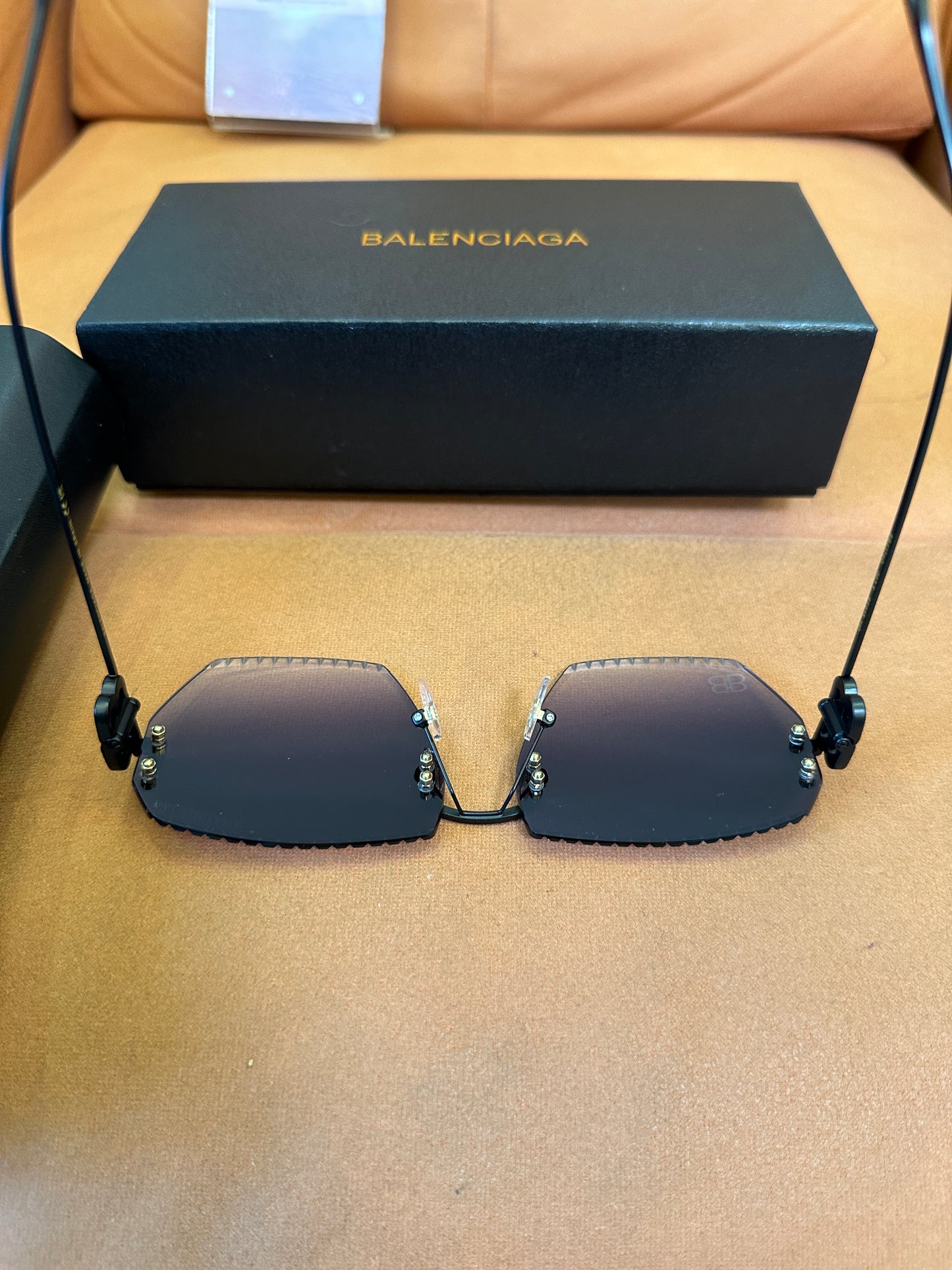 Balenciaga BB0174Q 007T Rimless Sunglasses – Black Studded Shield Sesign