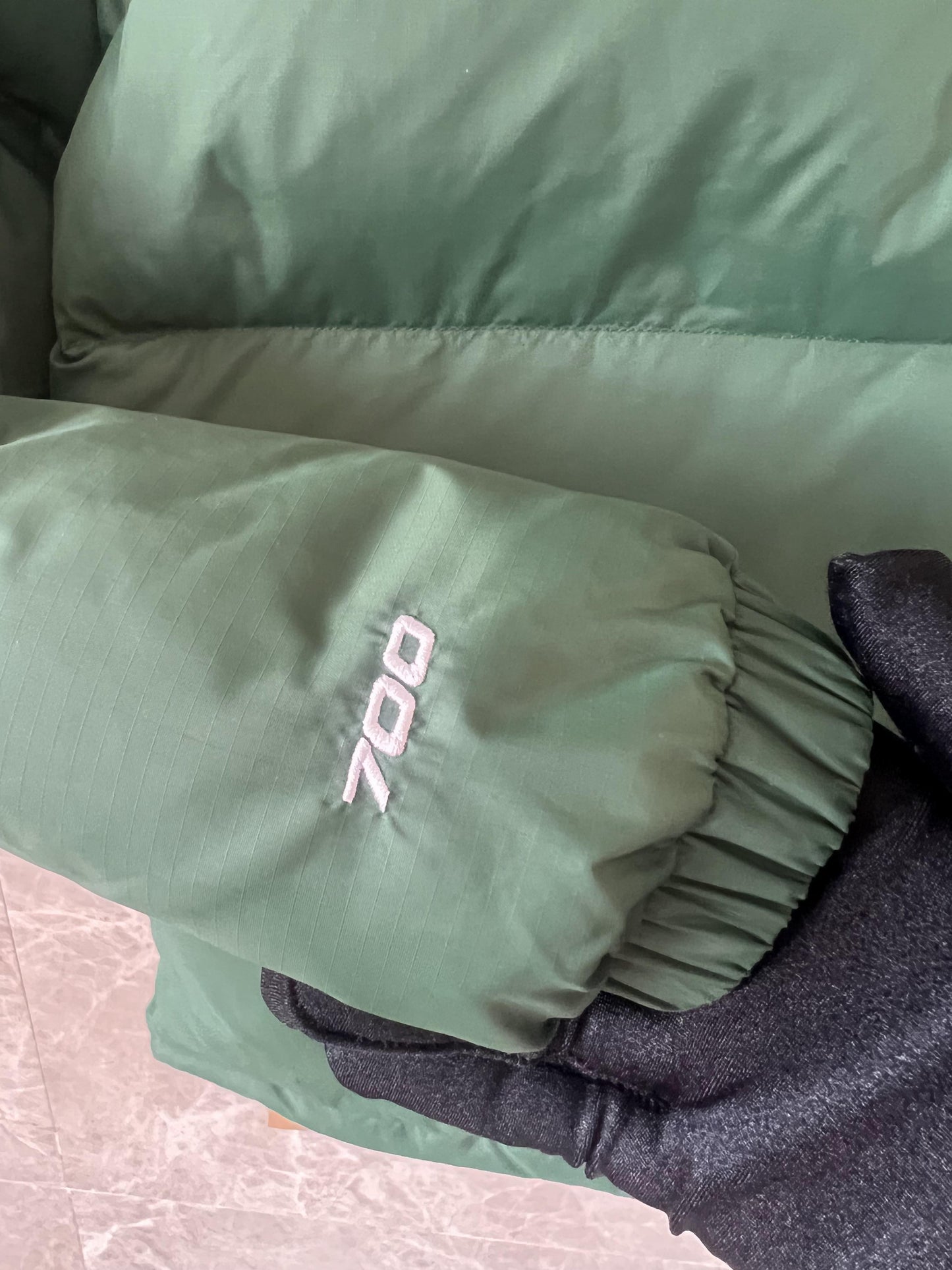 The North Face men's green down jacket