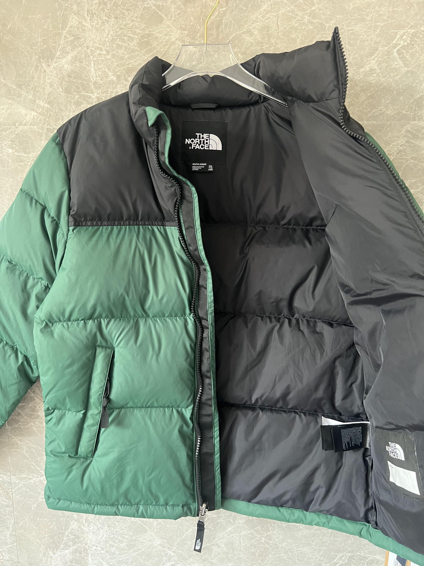The North Face men's green down jacket