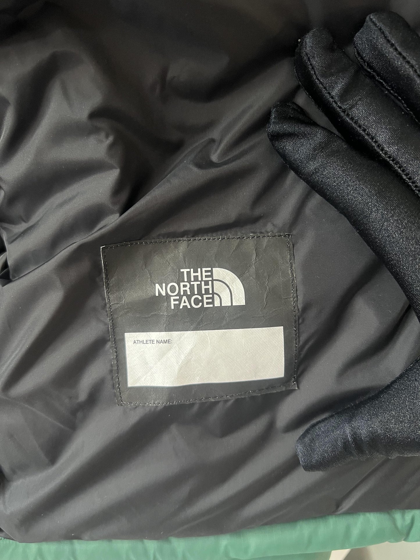 The North Face men's green down jacket