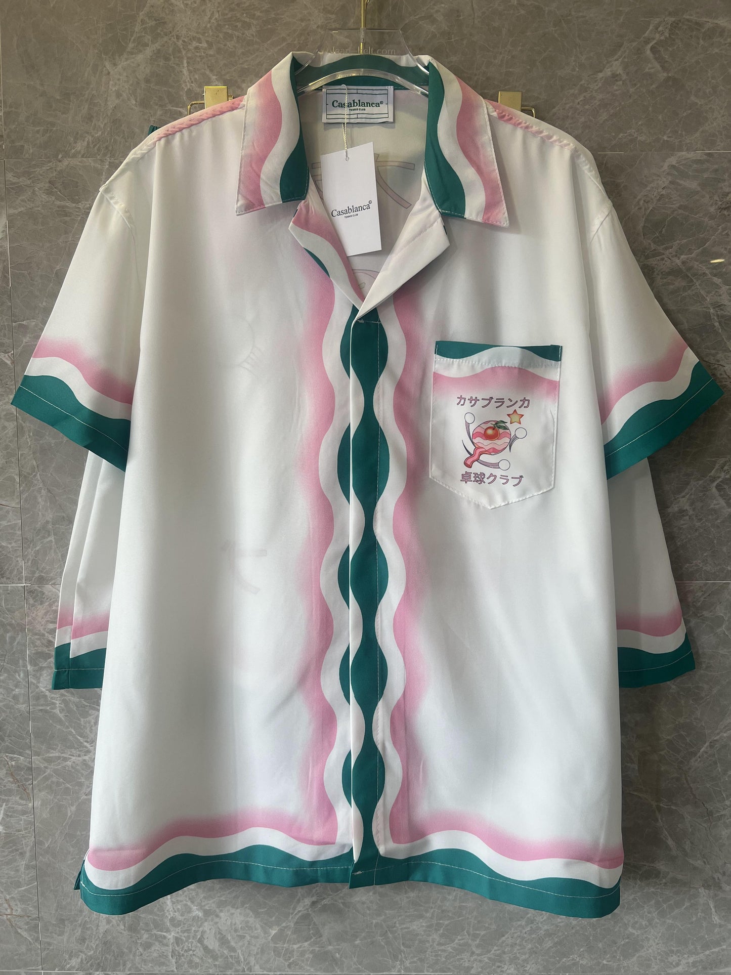 Conjunto de camisa y pantalón corto de seda blanca y multicolor de Casablanca