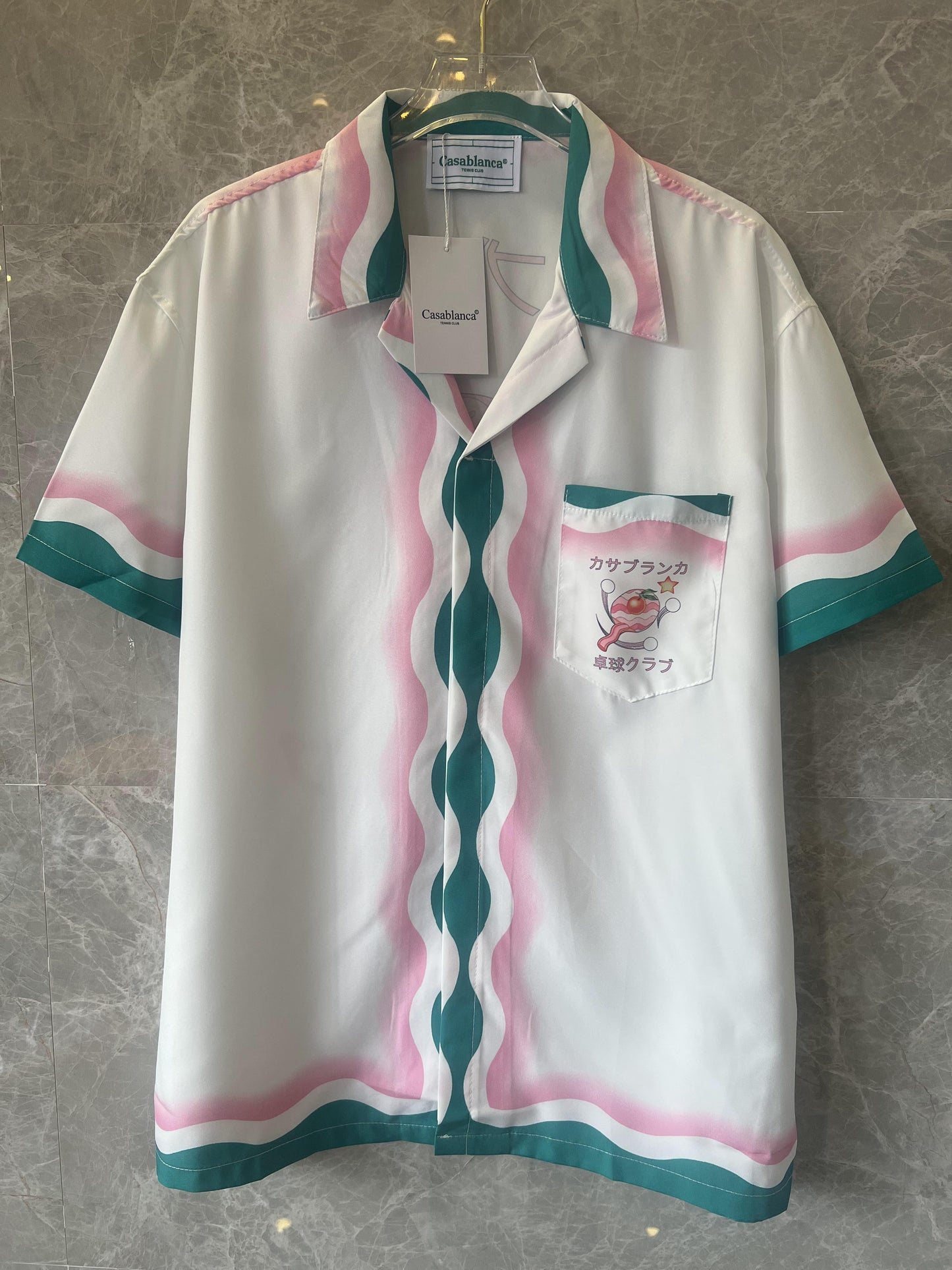 Conjunto de camisa y pantalón corto de seda blanca y multicolor de Casablanca