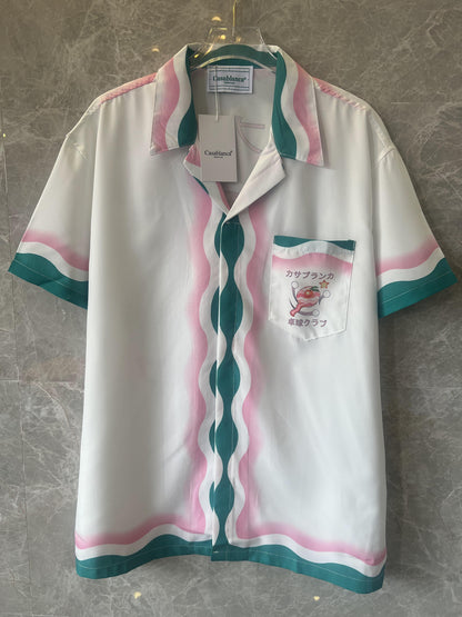 Conjunto de camisa y pantalón corto de seda blanca y multicolor de Casablanca