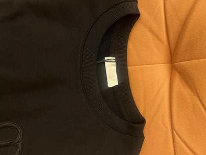 Suéter de punto negro de Christian Dior con detalle de estrella