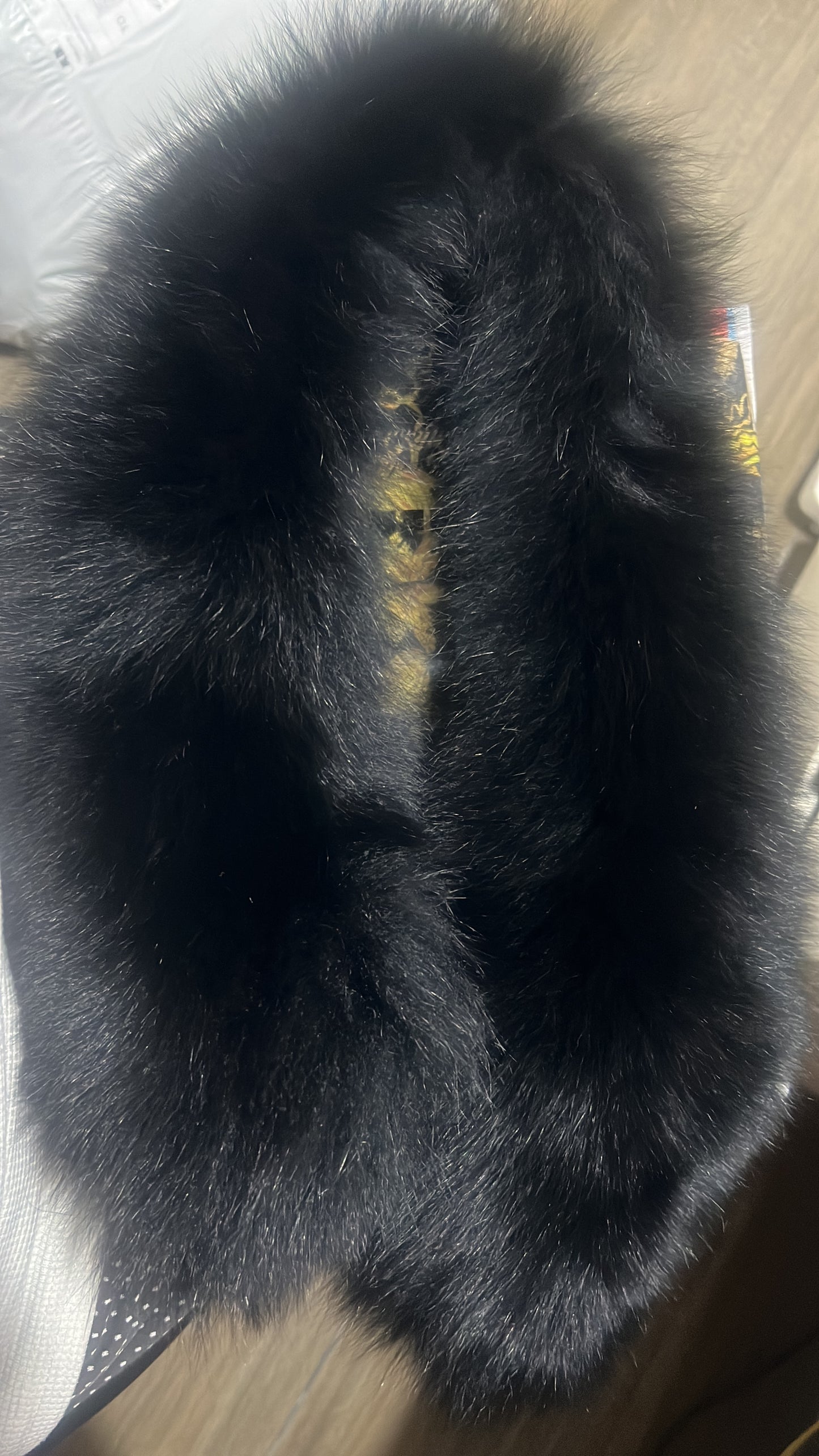 Prada down jacket with fur-trimmed hood in black