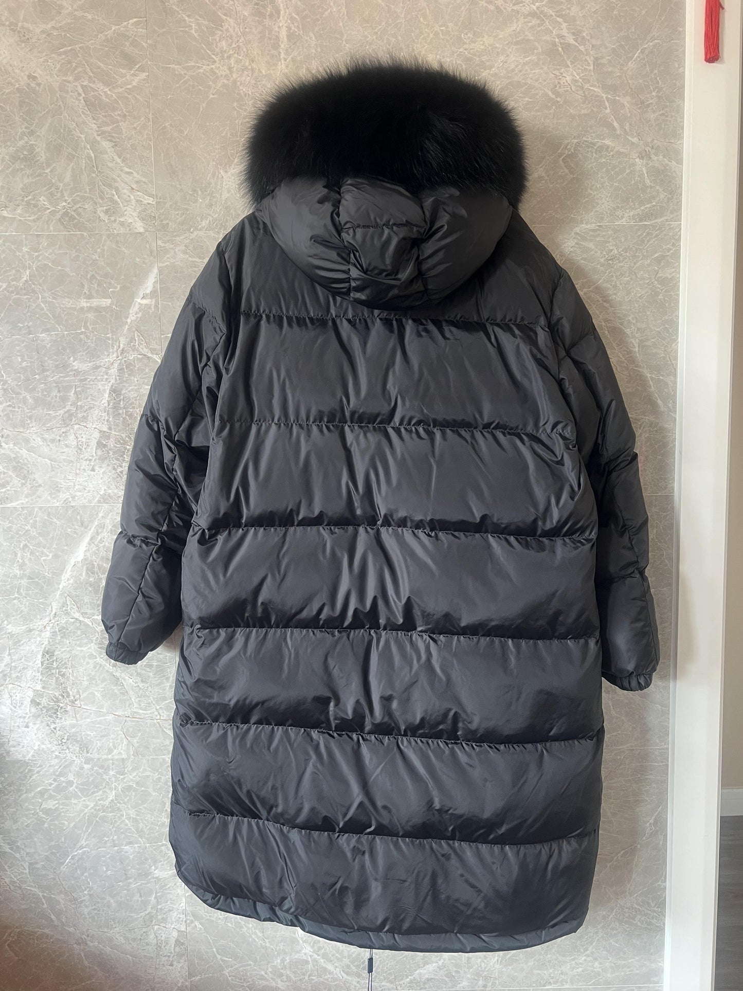 Prada down jacket with fur-trimmed hood in black