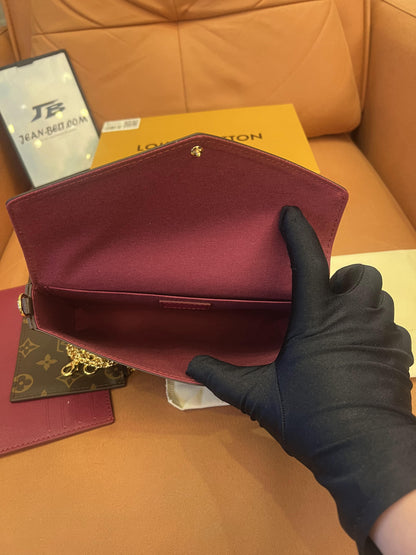 Cartera con cadena Felicie y pochette con monograma de Louis Vuitton fucsia