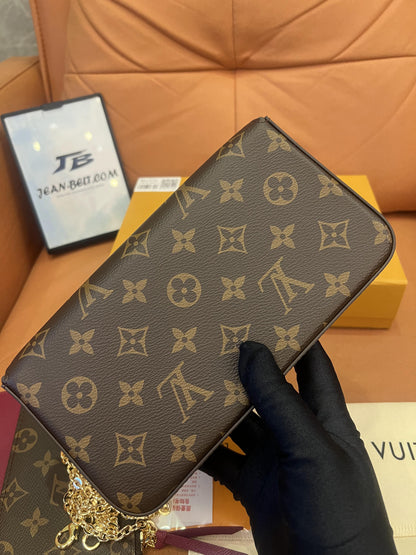 Cartera con cadena Felicie y pochette con monograma de Louis Vuitton fucsia