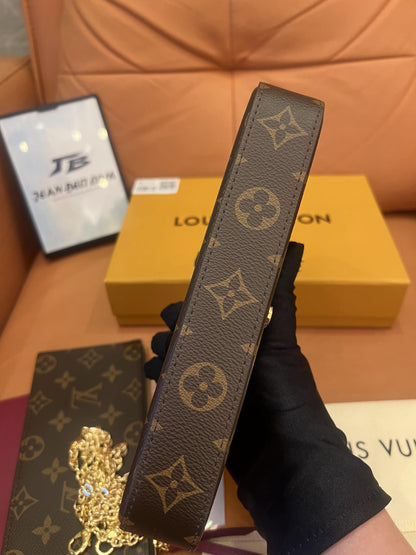 Cartera con cadena Felicie y pochette con monograma de Louis Vuitton fucsia