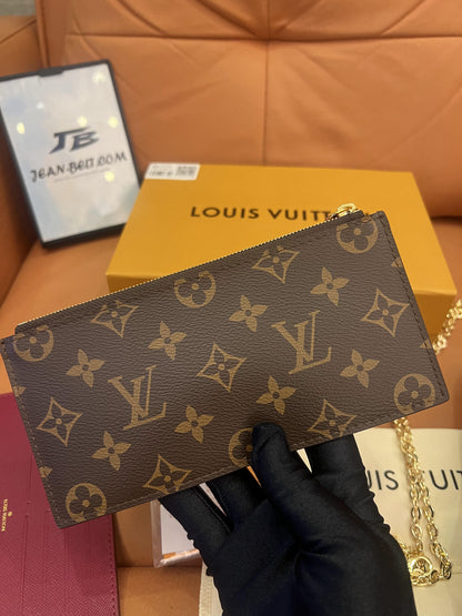 Cartera con cadena Felicie y pochette con monograma de Louis Vuitton fucsia
