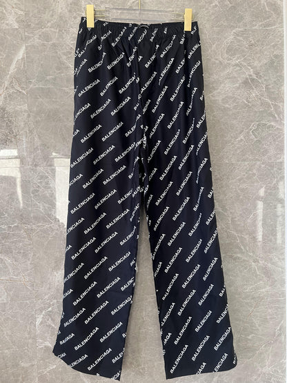 Balenciaga All-Over Logo Track Pants in Black