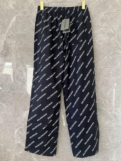 Balenciaga All-Over Logo Track Pants in Black