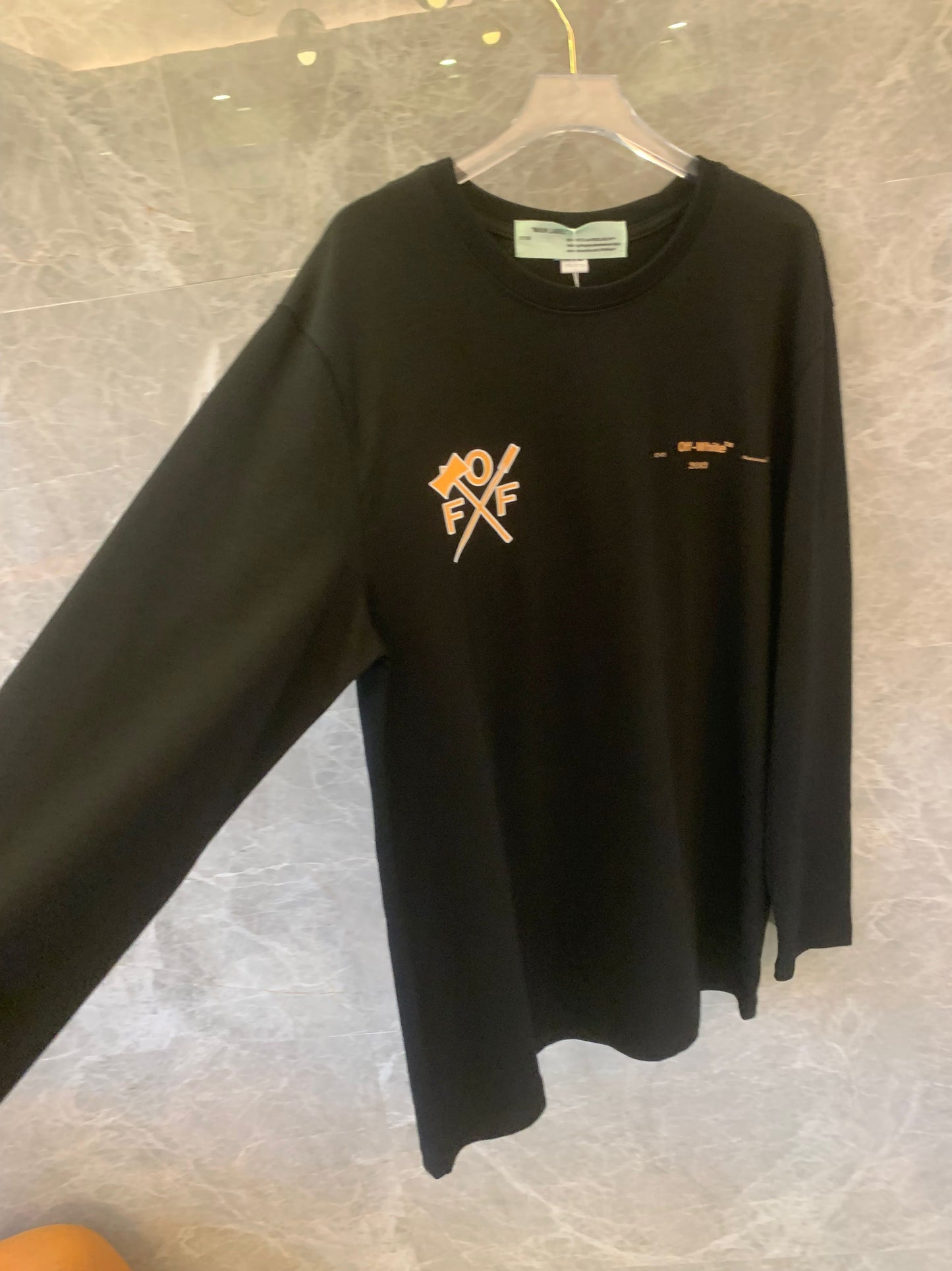 Off-White™ "Arrows" black long-sleeve t-shirt with bold orange graphics