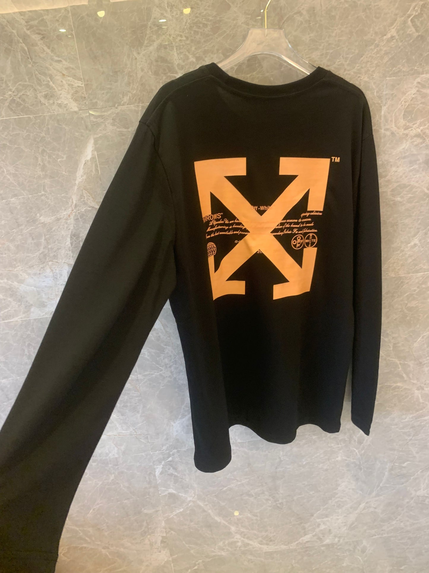 Off-White™ "Arrows" black long-sleeve t-shirt with bold orange graphics