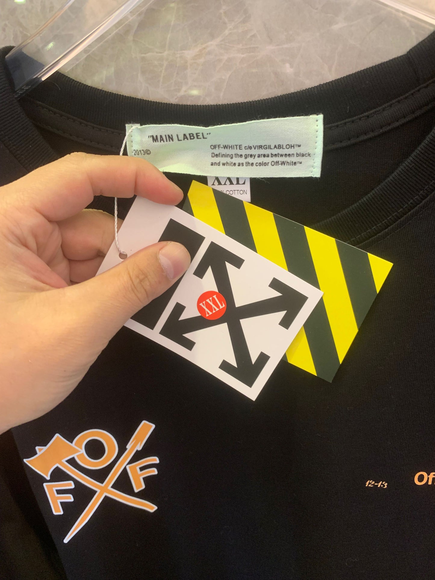 Off-White™ "Arrows" black long-sleeve t-shirt with bold orange graphics
