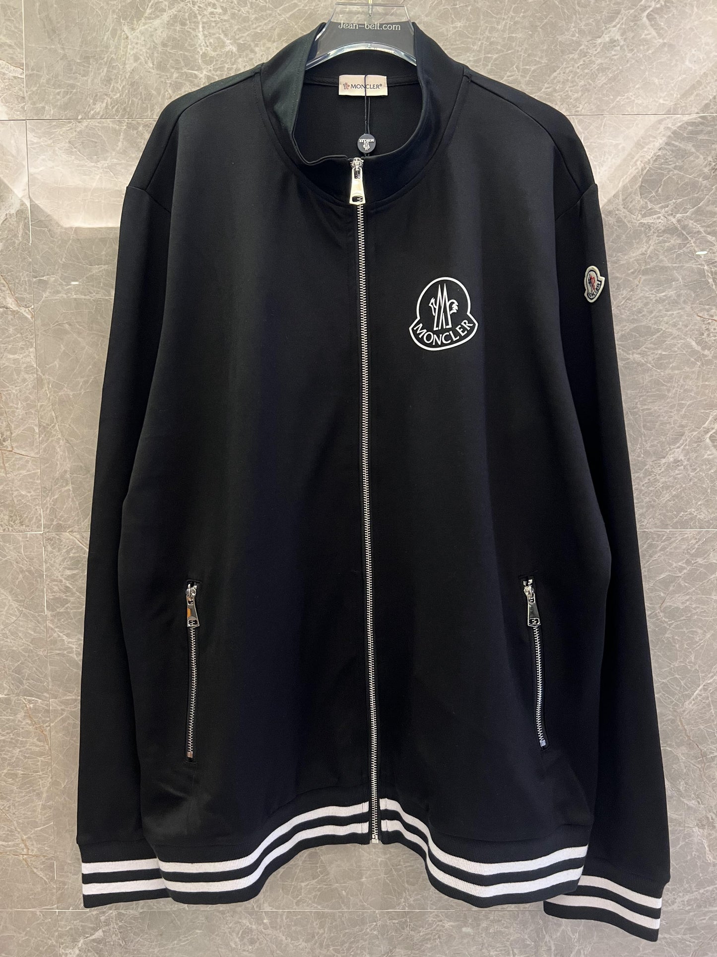 Conjunto de chaqueta y pantalón deportivo negro Moncler con ribete blanco