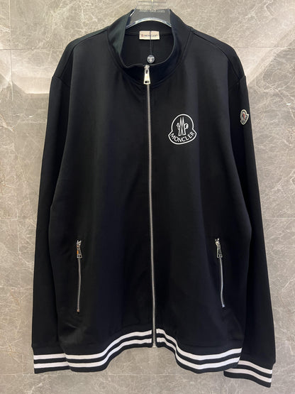 Conjunto de chaqueta y pantalón deportivo negro Moncler con ribete blanco