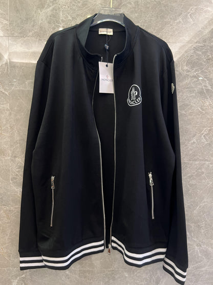 Conjunto de chaqueta y pantalón deportivo negro Moncler con ribete blanco