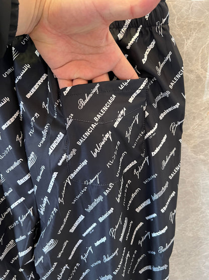 Balenciaga All-Over Logo Track Pants in Black