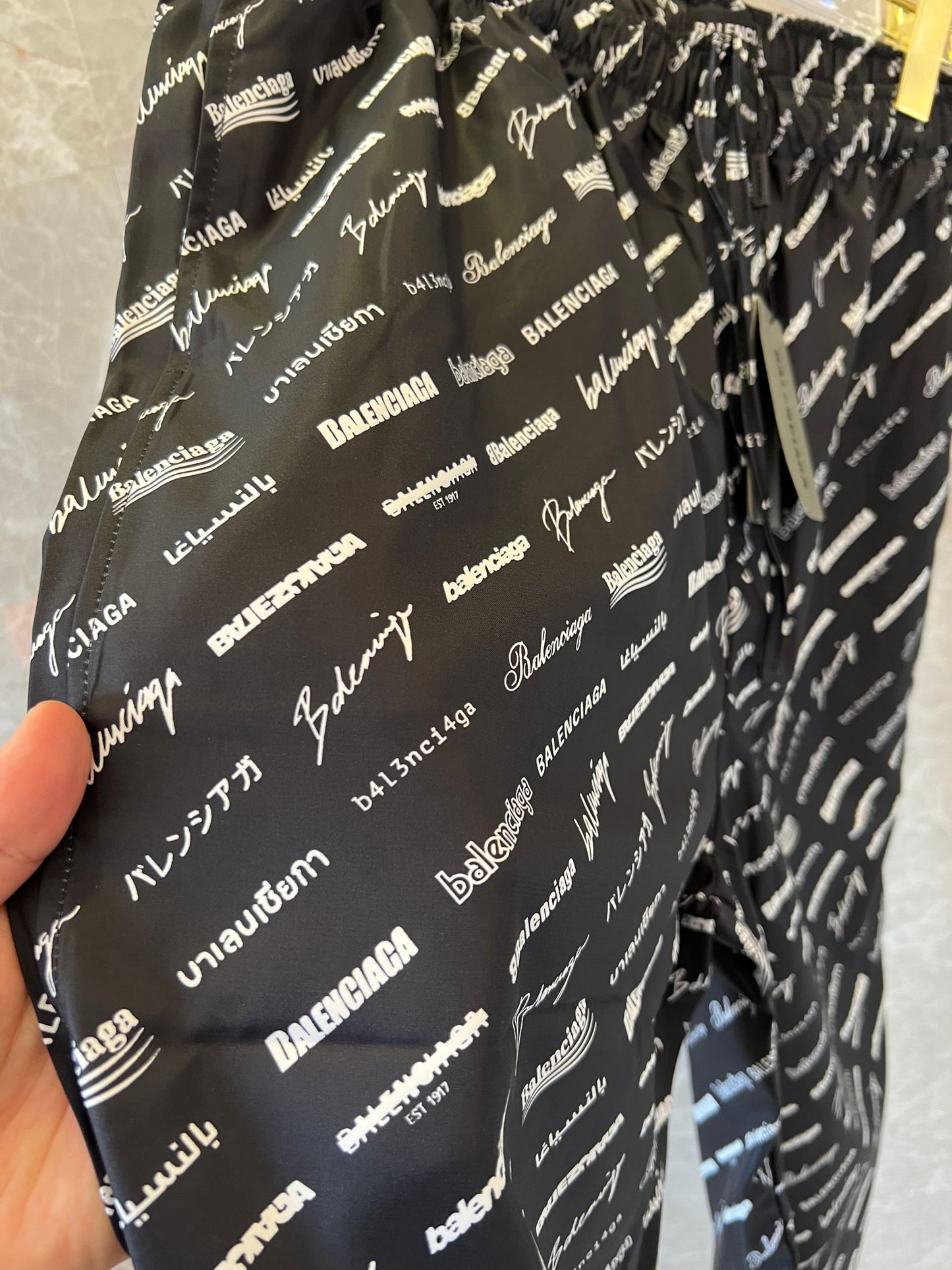 Balenciaga All-Over Logo Track Pants in Black