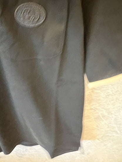 Polo negro Gucci con icónicas rayas tribanda