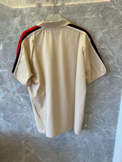 Polo Gucci con bloques de color y mangas a rayas rojas y verdes