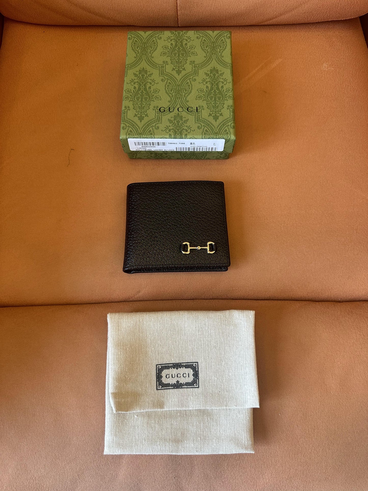 Cartera plegable Gucci de piel con diseño de bocado de caballo (negra)