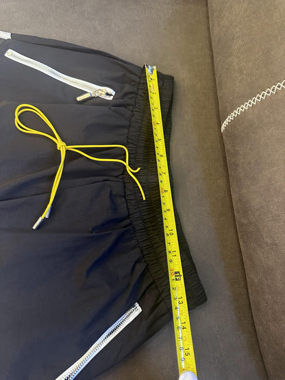 Rhude black and white logo shorts with yellow drawstring and zipper detail