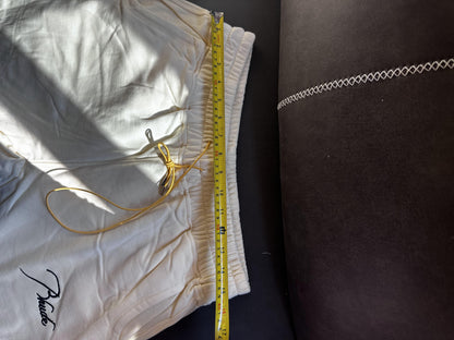 Conjunto de chándal Rhude color crema con bordado característico