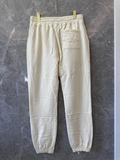 Conjunto de chándal Rhude color crema con bordado característico