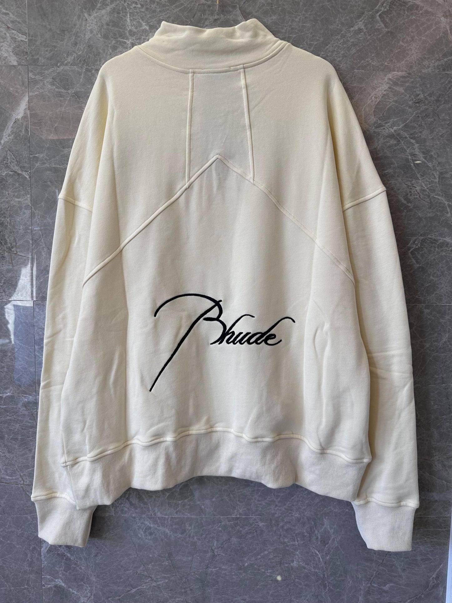 Conjunto de chándal Rhude color crema con bordado característico
