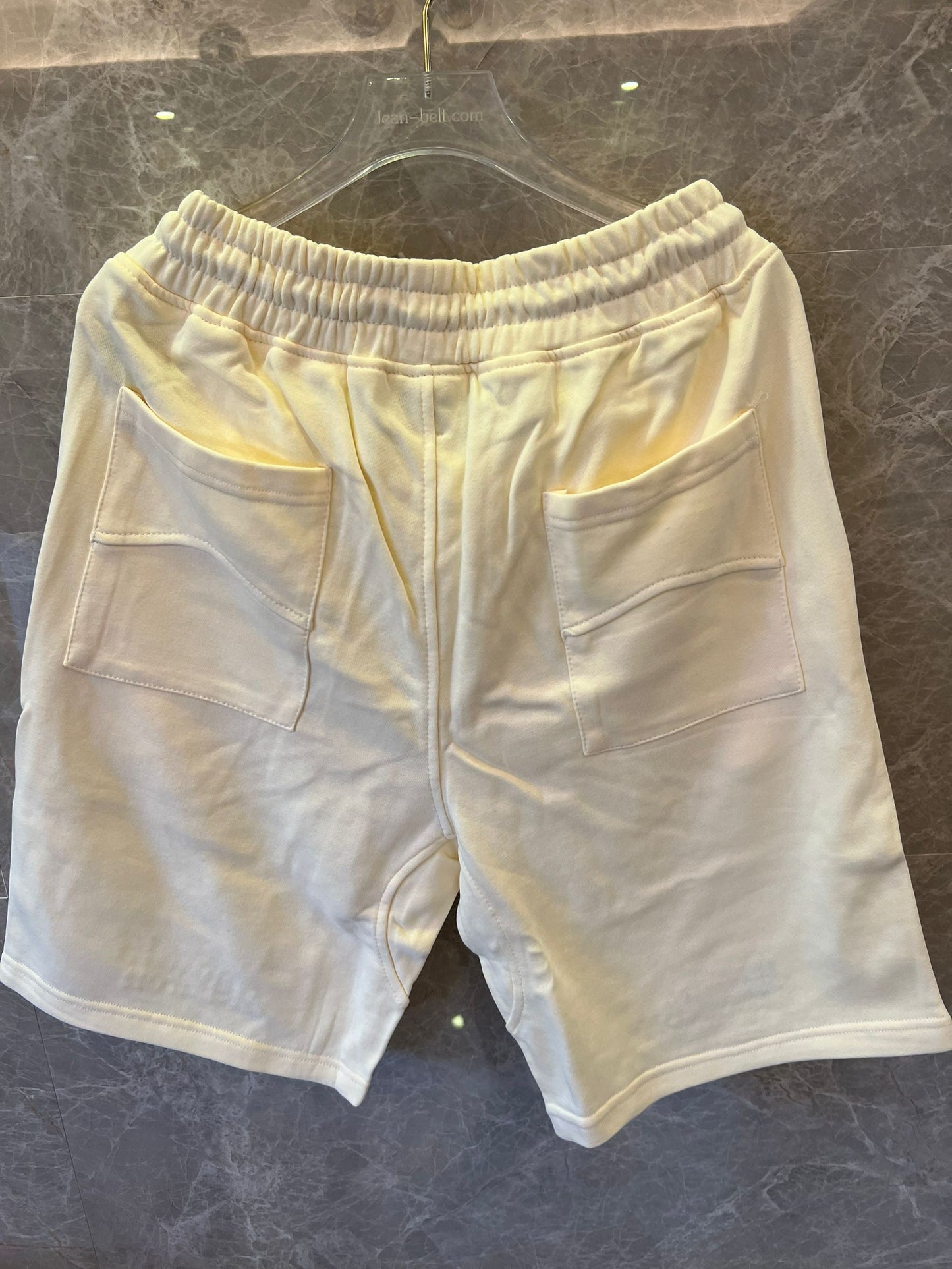 Shorts brancos com cordão e logotipo Rhude x McLaren