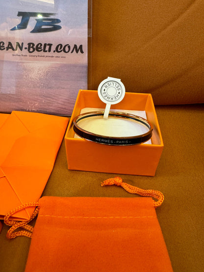 Brazalete de esmalte Hermes Sellier con detalles dorados