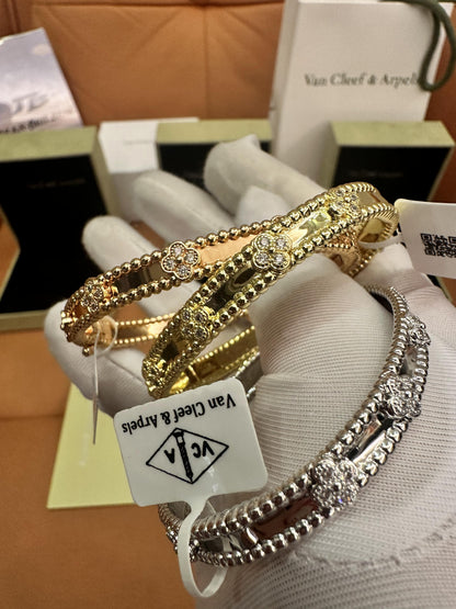 Pulseras de diamantes Van Cleef &amp; Arpels Perlée Clover en oro amarillo, oro blanco y oro rosa