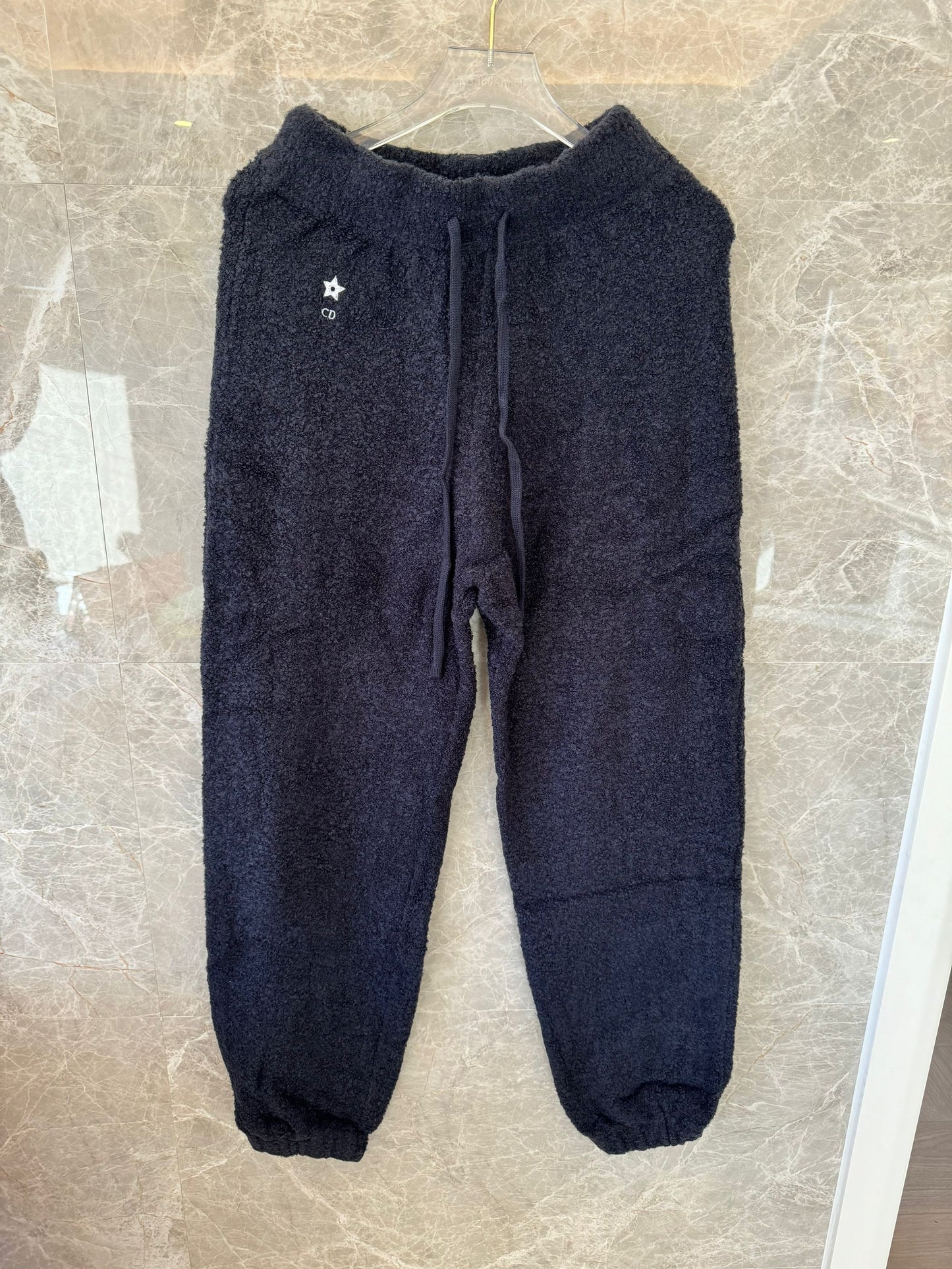 Conjunto de sudadera y pantalón de punto con textura suave de Dior en negro