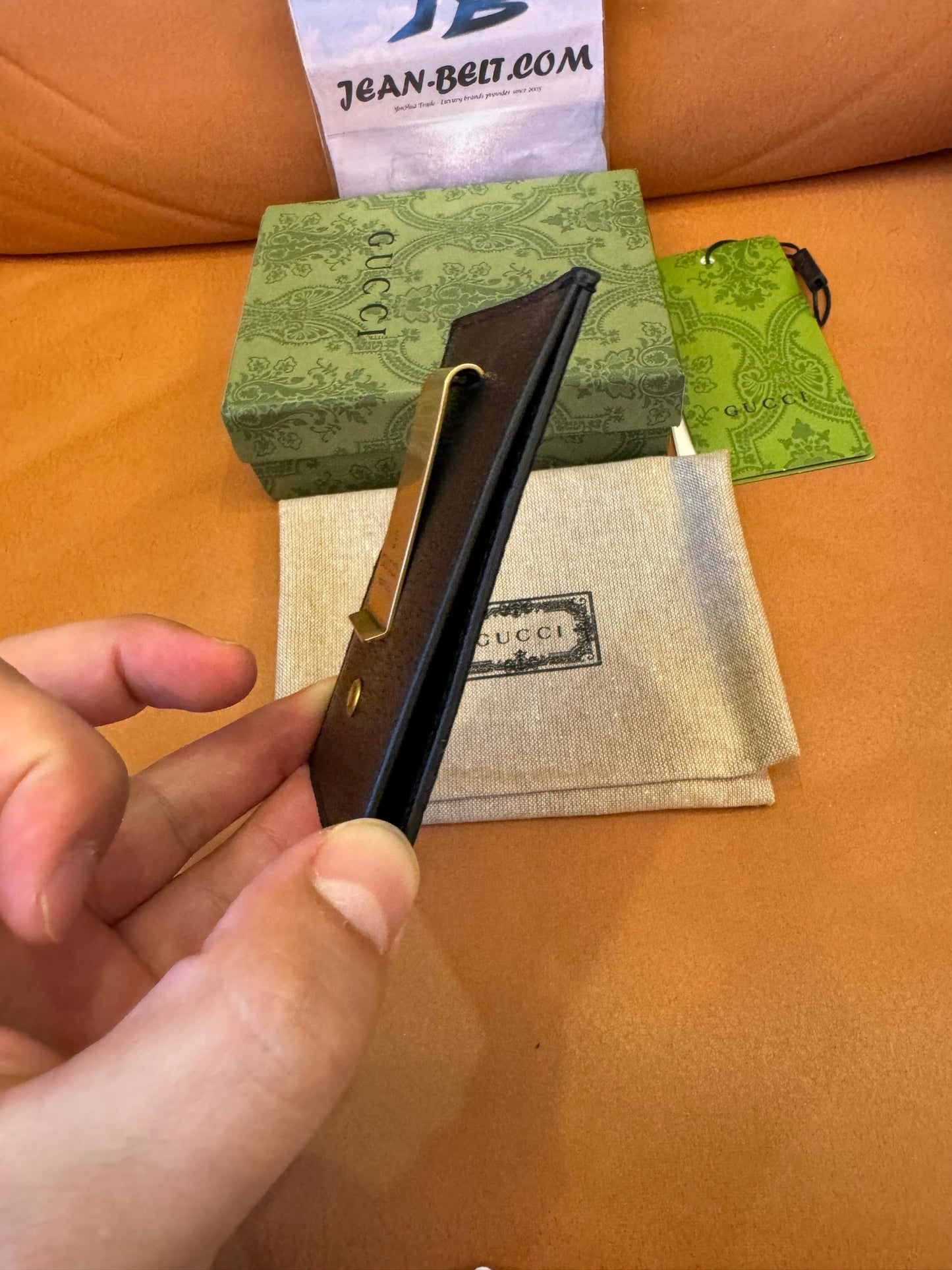 Gucci Porta-cartões com presilha para notas em couro GG
