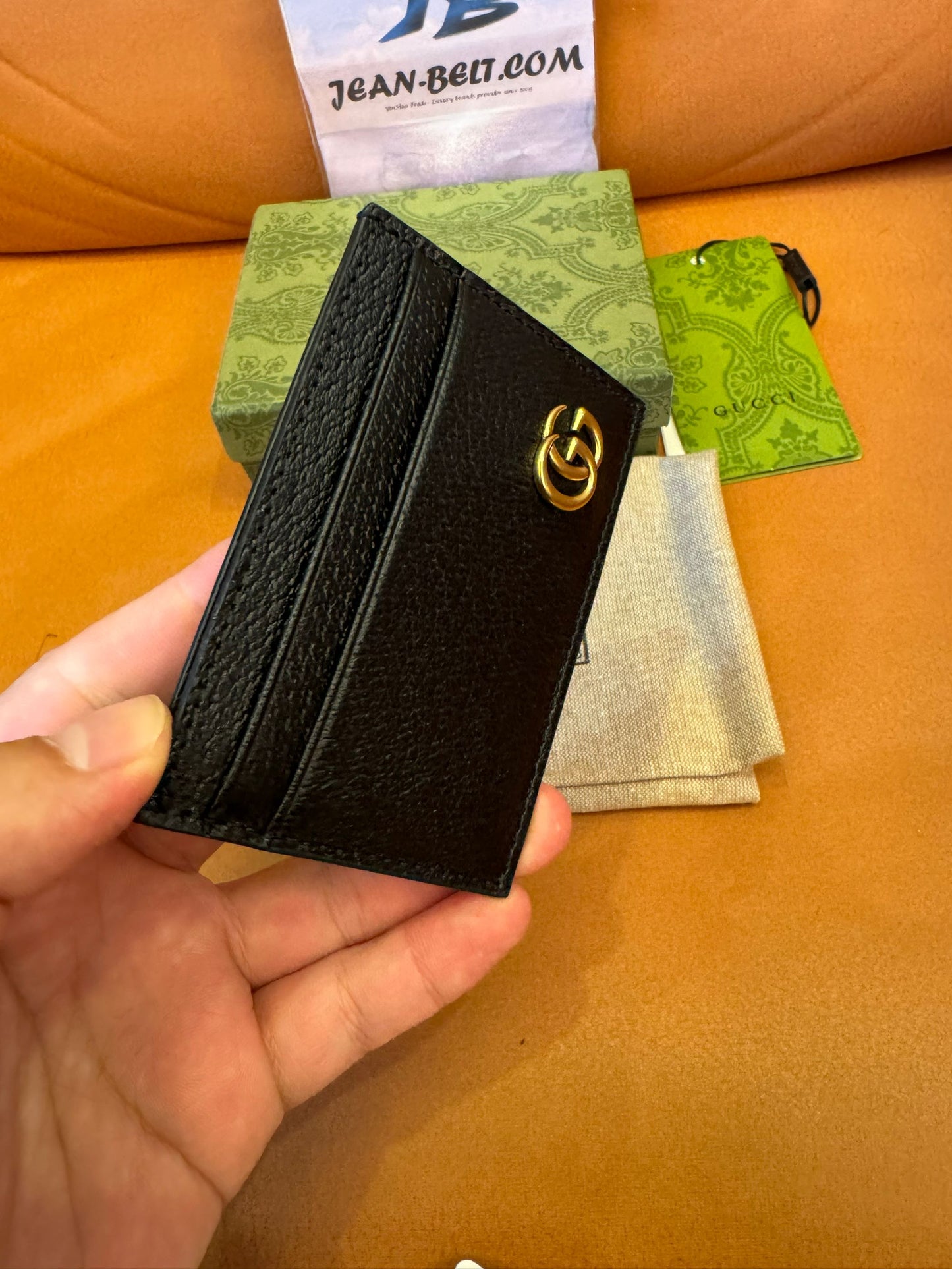 Gucci Porta-cartões com presilha para notas em couro GG