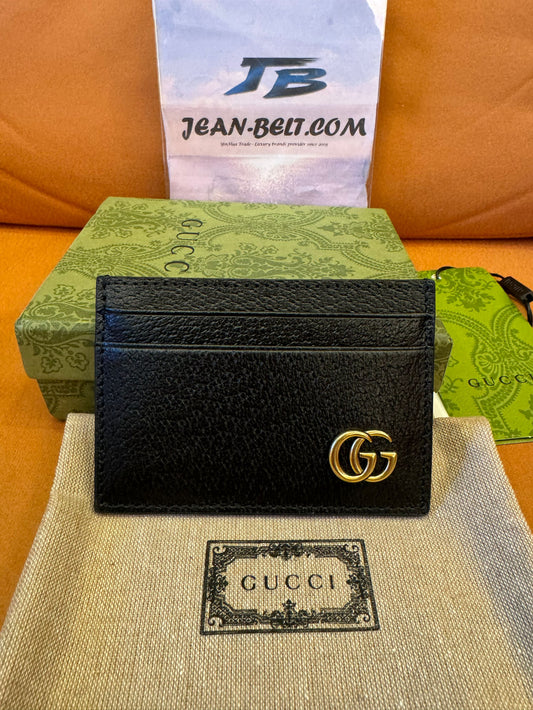Gucci Porta-cartões com presilha para notas em couro GG