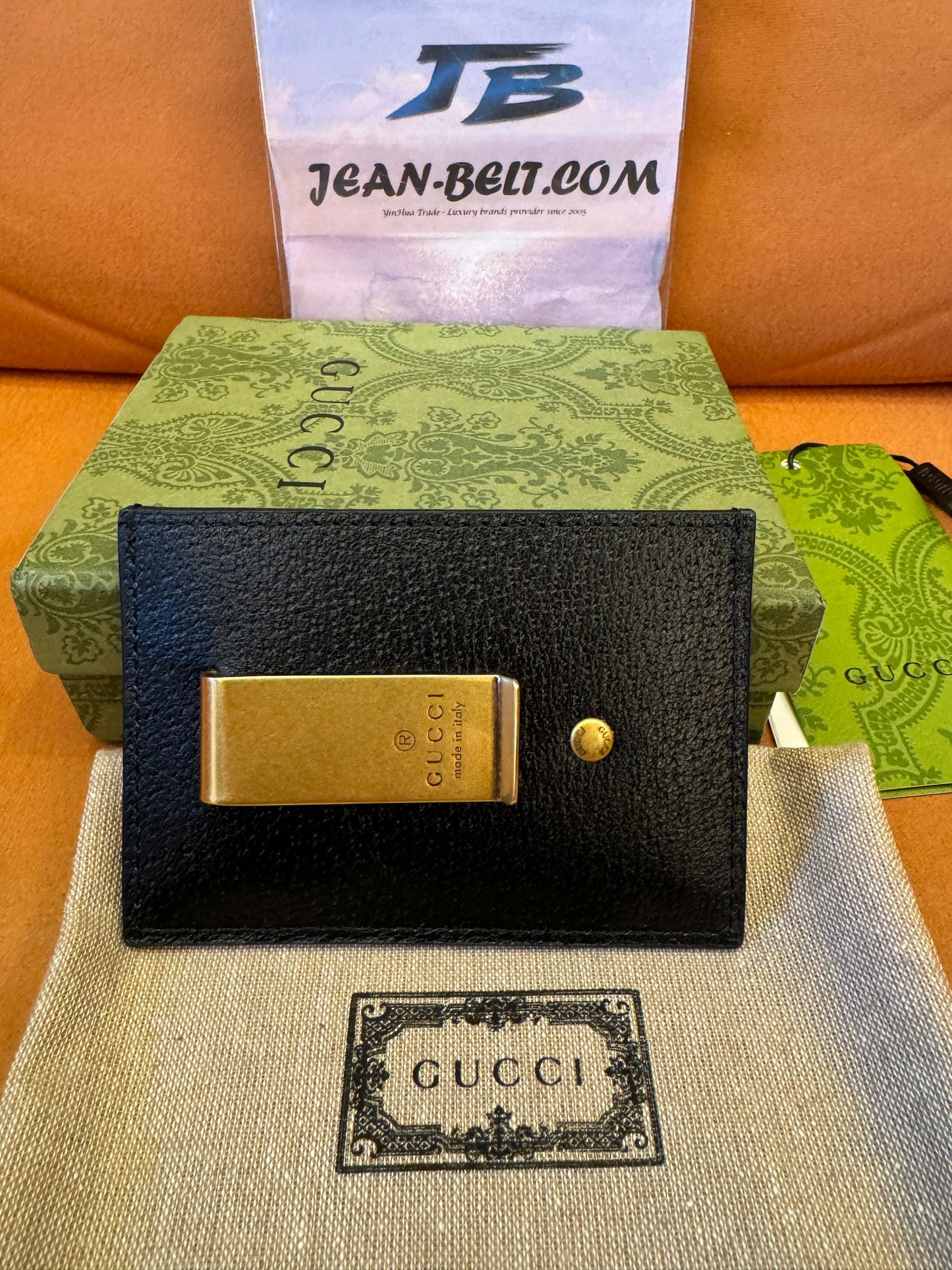 Gucci Porta-cartões com presilha para notas em couro GG