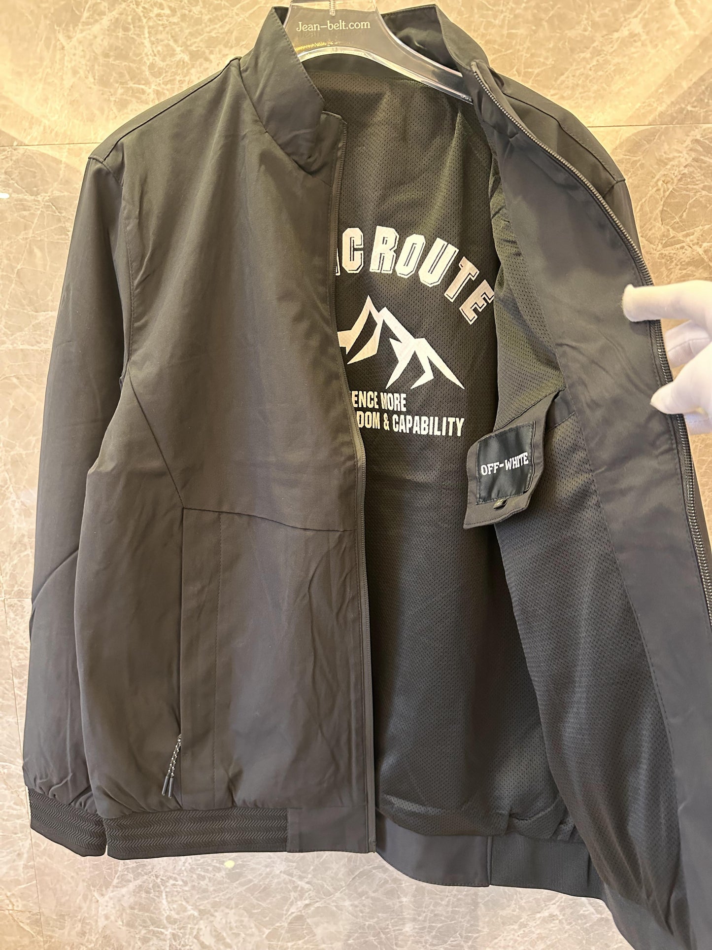 Off-White black jacket with "Explore the World" embroidery