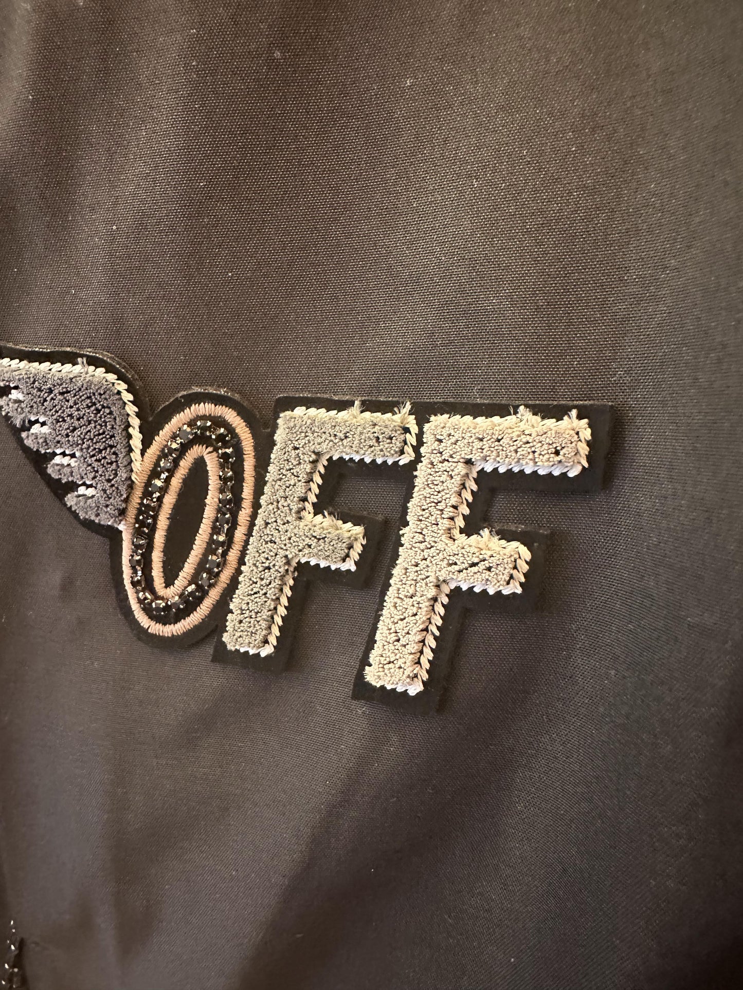 Off-White black jacket with "Explore the World" embroidery