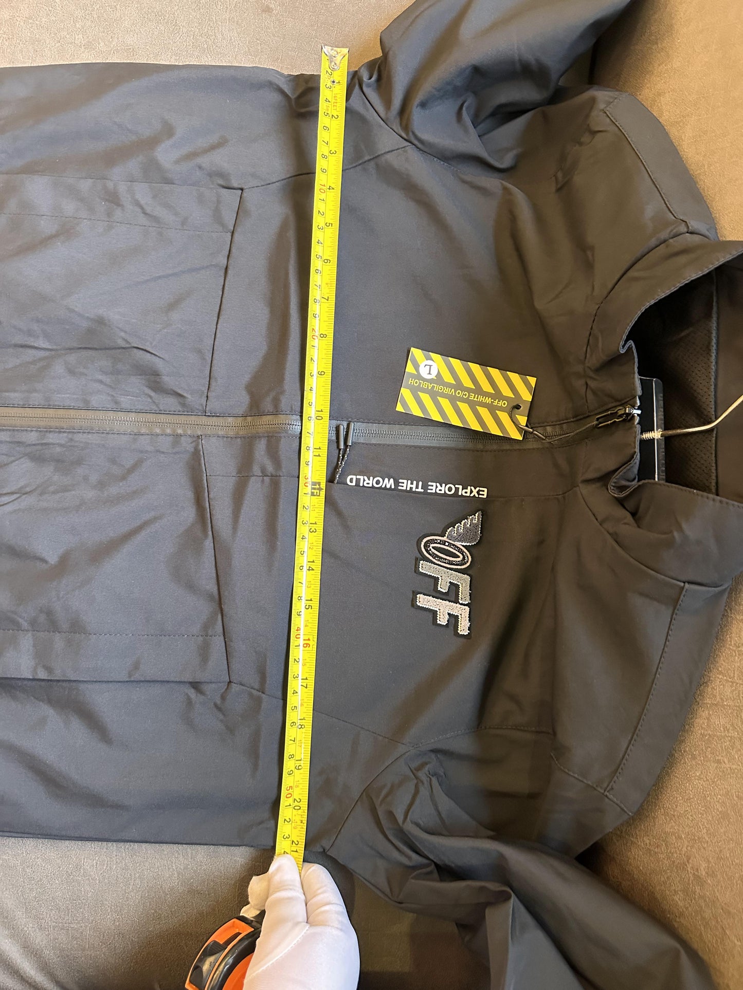 Off-White black jacket with "Explore the World" embroidery