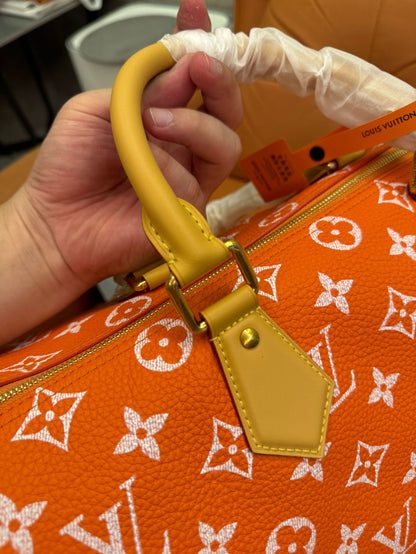 Bandoulière rápida de lona naranja con monograma de Louis Vuitton 30