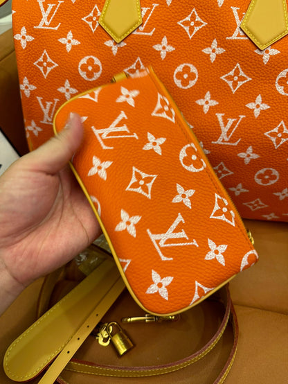 Bandoulière rápida de lona naranja con monograma de Louis Vuitton 30