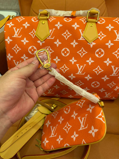 Bandoulière rápida de lona naranja con monograma de Louis Vuitton 30